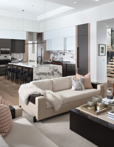 Modern open-plan living space with kitchen, dining, and living areas.